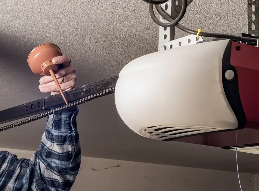 lubricating a noisy garage door in Springfield IL