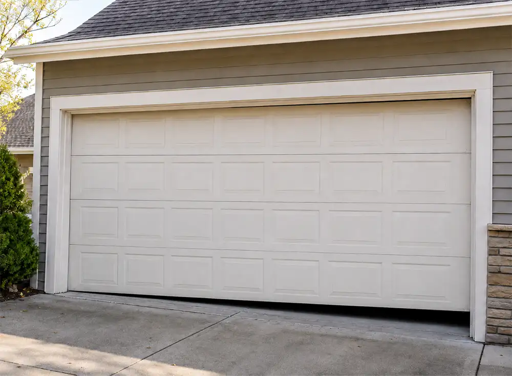 garage door that is hanging unevenly due to a broken spring in the Springfield IL area